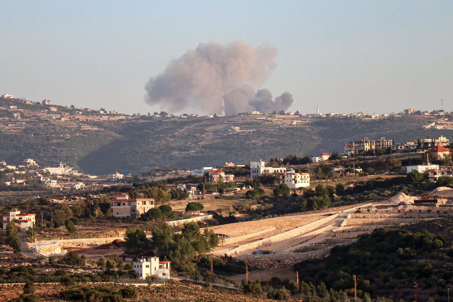 This picture taken from southern Lebanon shows smoke rising after an Israeli strike between the villages of Qaouzah and Ramia near the border with Israel on December 3, 2023. (Photo by AFP)