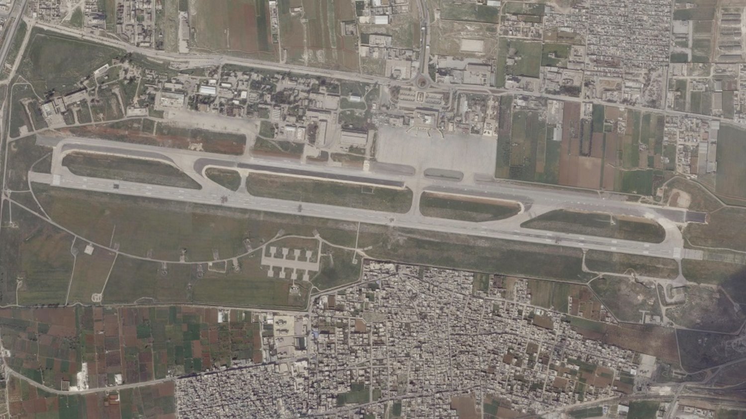 This satellite image from Planet Labs PBC shows damage on the runway of Aleppo International Airport after a suspected Israeli strike there in Aleppo, Syria, Tuesday, March 7, 2023. (Planet Labs PBC via AP)
