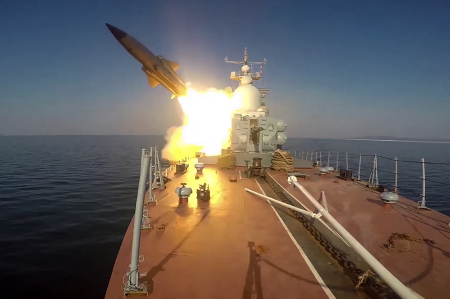 This grab taken from a footage released by the Russian Defense Ministry on March 28, 2023 shows a missile boat of the Pacific Fleet firing a Moskit cruise missile at a mock enemy sea target in the Sea of Japan during military exercises. (Handout / Russian Defense Ministry / AFP)
