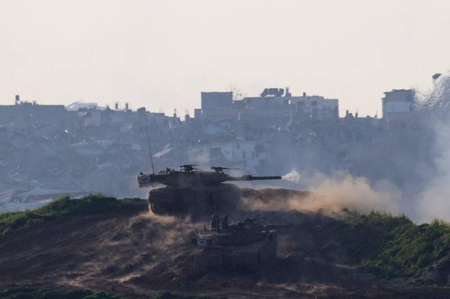  An Israeli tank fires into the Gaza Strip from Israel, amid the ongoing conflict between Israel and the Palestinian Islamist group Hamas, as seen from Israel, February 21, 2024. (Reuters)