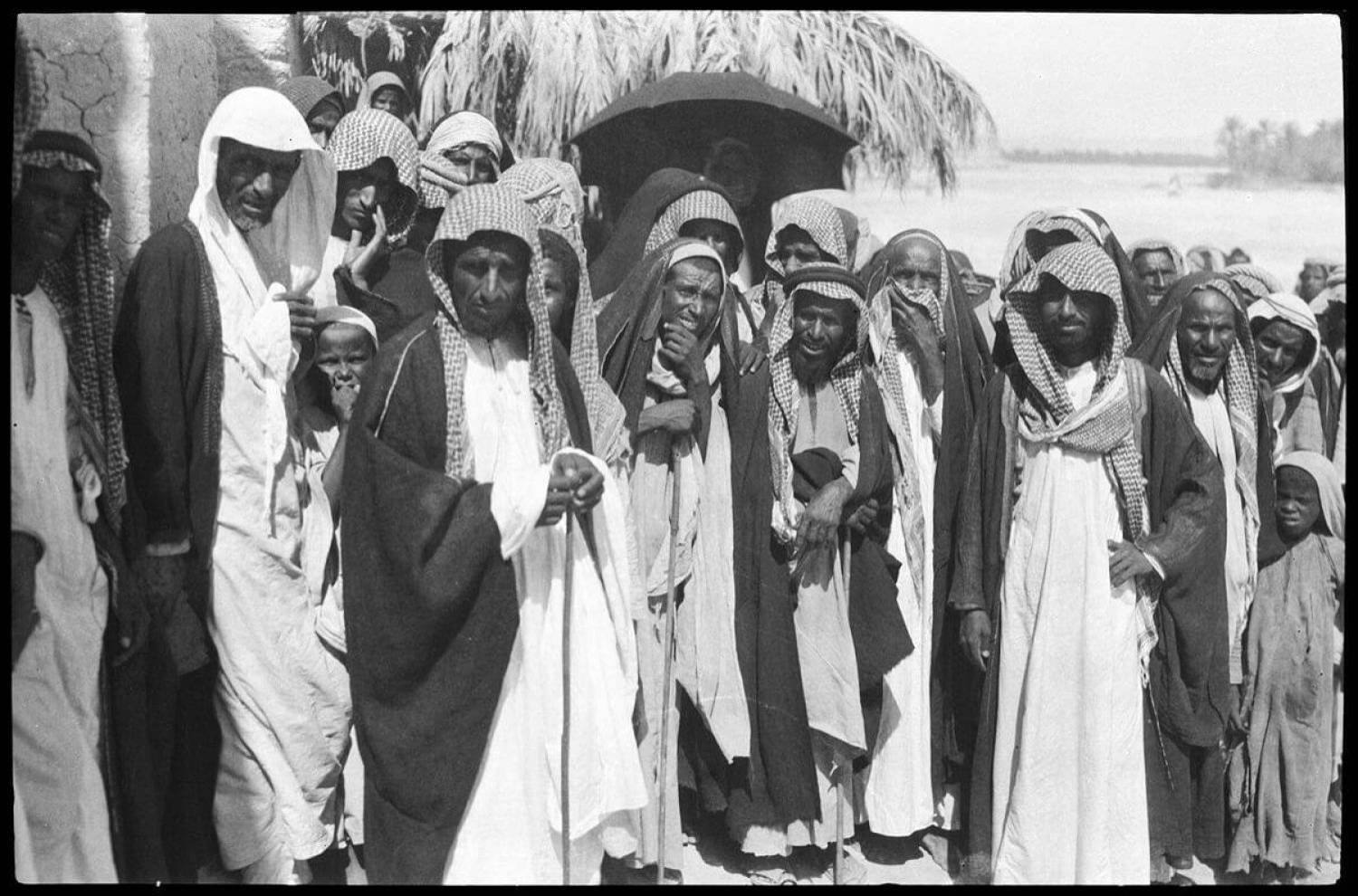 A group of people in an old Saudi market (Asharq Al-Awsat)