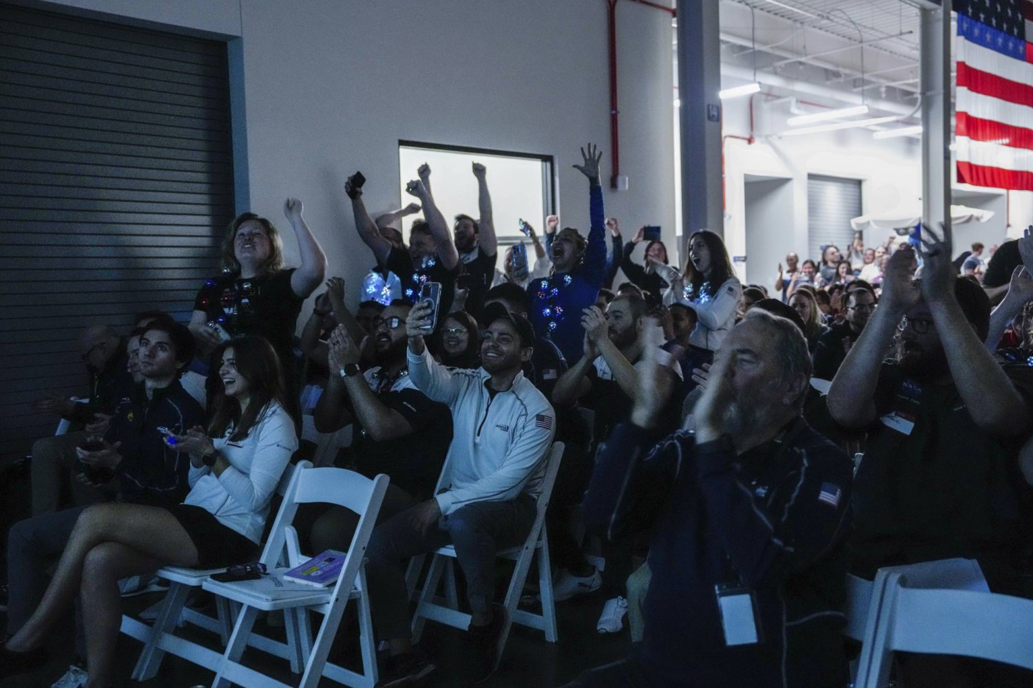 Intuitive Machines employees cheer during a watch party moments after they became the first commercial company to softly land on the moon on Thursday, Feb. 22, 2024, in Houston. ( Raquel Natalicchio/Houston Chronicle via AP)