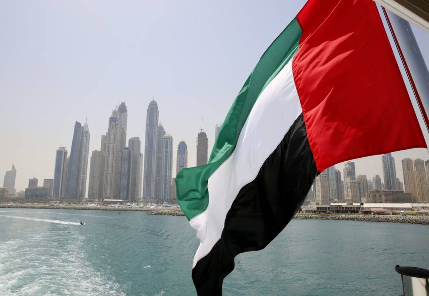 A UAE flag flies over a boat at Dubai Marina, Dubai, United Arab Emirates May 22, 2015. (Reuters)