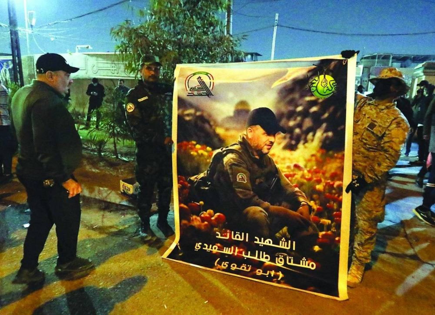 A poster of Mushtaq Taleb al-Saidi, who was killed in a US strike in Baghdad in January. (dpa)