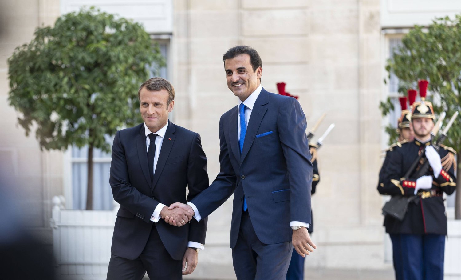Emir of Qatar Sheikh Tamim bin Hamad Al Thani meets with French President Emmanuel Macron in Paris in 2019. (Qatar’s Amiri Diwan) 