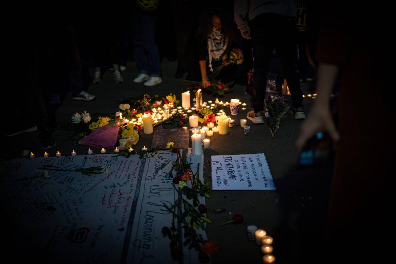 26 February 2024, US, Washington: Activists gather outside the Israeli Embassy in Washington, holding a vigil to honour Aaron Bushnell, the 25-year-old serviceman who self-immolated in protest of Israel. Photo: Natascha Tahabsem/ZUMA Press Wire/dpa