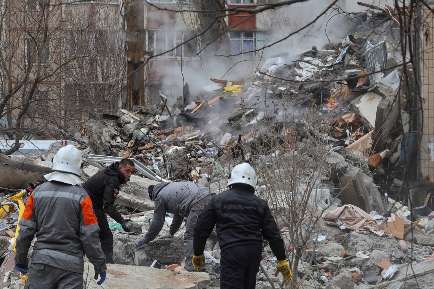 Rescuers work at the site of an apartment building heavily damaged by a Russian drone strike, amid Russia's attack on Ukraine, in Odesa, Ukraine March 2, 2024. REUTERS/Stringer