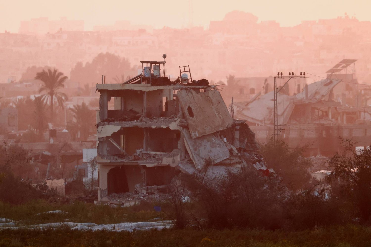 A damaged building from Gaza is pictured, amid the ongoing conflict between Israel and Hamas, as seen from Southern Israel, March 2, 2024. REUTERS/Amir Cohen