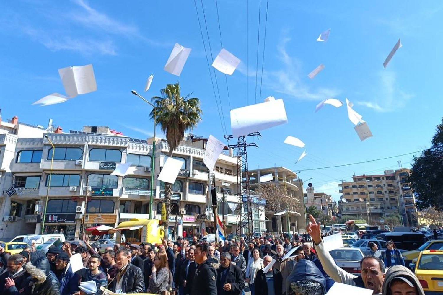 A handout picture released by the Suwayda 24 news site shows people protesting in the southern Syrian city of Sweida on February 28, 2024. (Suwayda 24/AFP)