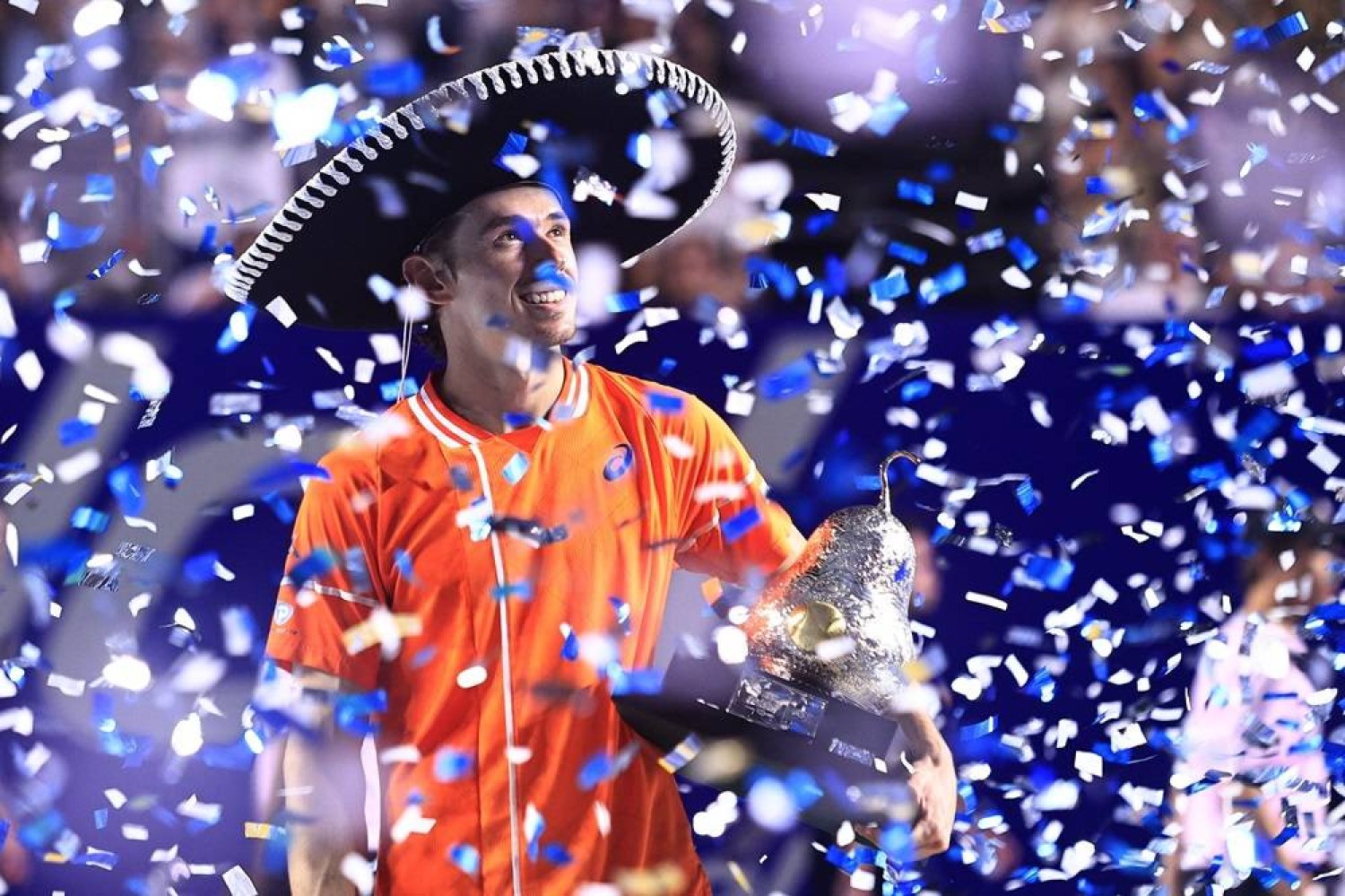 Alex De Minaur of Australia celebrates with the champion trophy after defeating Casper Ruud of Norway during the singles final at the Mexican Tennis Open in Acapulco state of Guerrero, Mexico, 02 March 2024. (EPA)