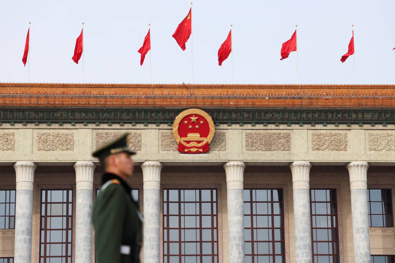 A paramilitary police officer stands guard, on the day of the opening session of the Chinese People's Political Consultative Conference (CPPCC), in front of the Great Hall of the People, in Beijing, China March 4, 2024. REUTERS/Tingshu Wang