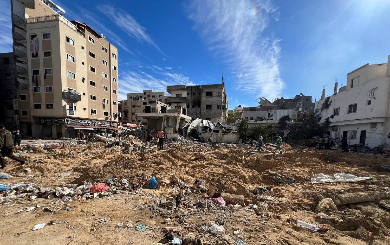 Palestinians inspect damages following an Israeli raid at Kamal Adwan hospital, amid the ongoing conflict between Israel and Palestinian group Hamas, in the northern Gaza Strip December 16, 2023. REUTERS/Fadi Alwhidifa
