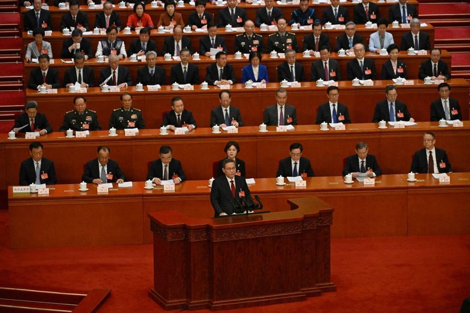 China's Premier Li Qiang delivers his work report at the opening session of the National People's Congress (NPC) at the Great Hall of the People in Beijing on March 5, 2024. (AFP)