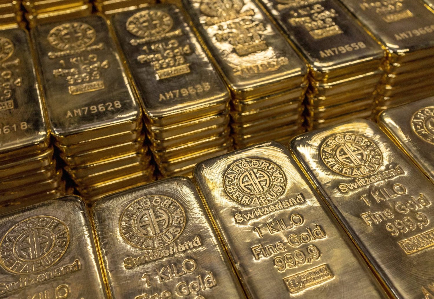 Gold prices steadied near a three-month peak. Reuters