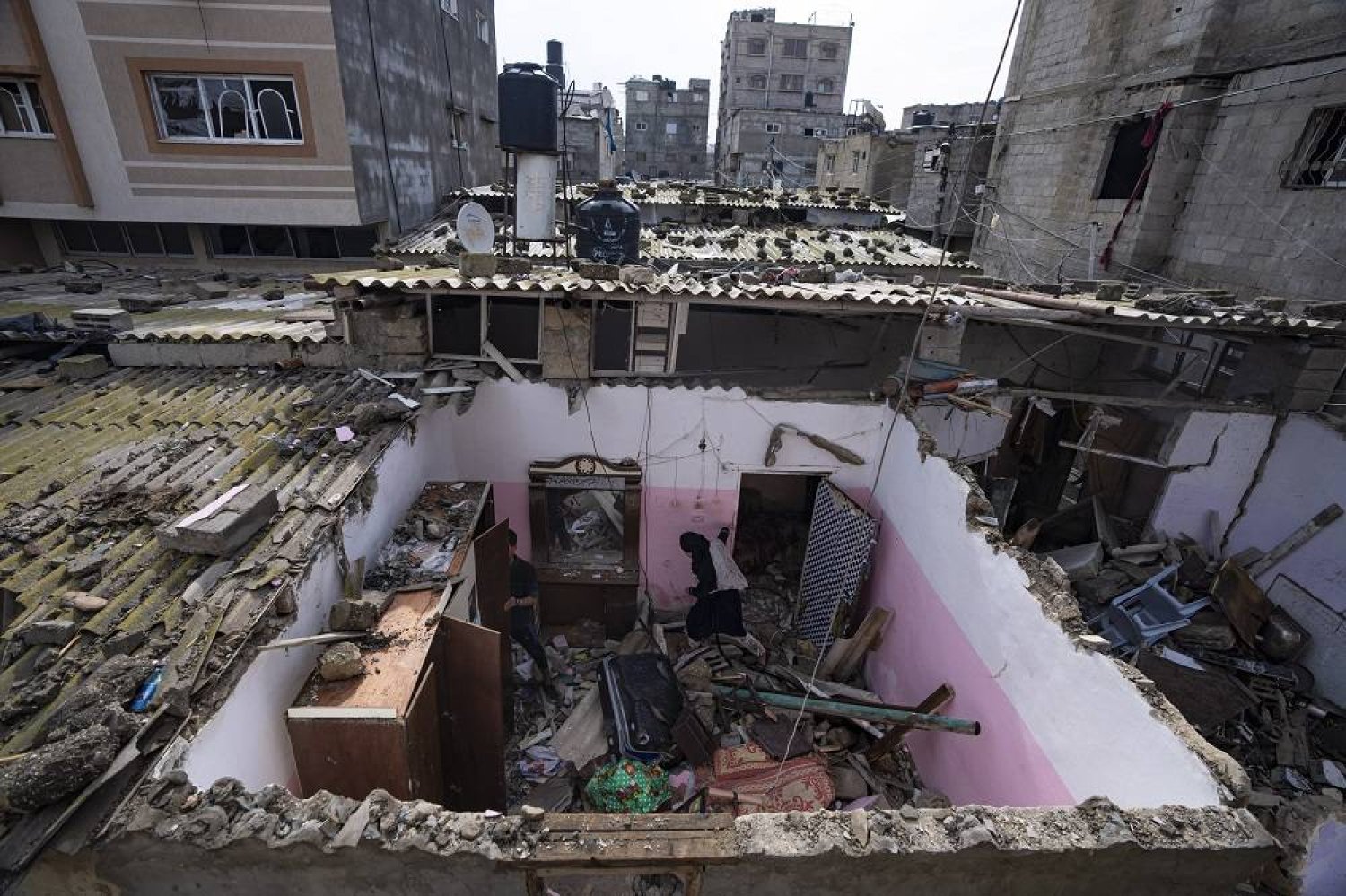 Palestinians inspect the damage to a house after an Israeli airstrike in Rafah, southern Gaza Strip, Tuesday, March 19, 2024. (AP)