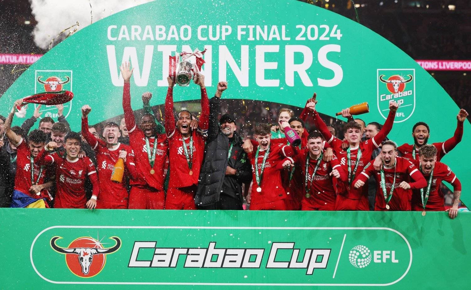 Liverpool’s captain Virgil van Dijk and head coach Jurgen Klopp and teammates celebrate after winning the EFL Carabao Cup final match between Chelsea FC and Liverpool FC at Wembley Stadium in London, Britain, 25 February 2024. EPA/ANDY RAIN
