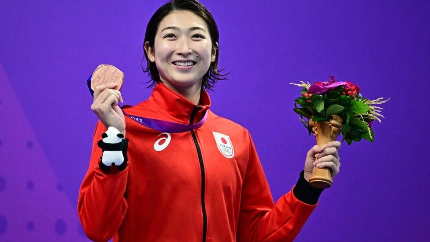 Rikako Ikee celebrates a bronze medal for the women's 50m butterfly at the Asian Games in Hangzhou last year. Manan VATSYAYANA / AFP
