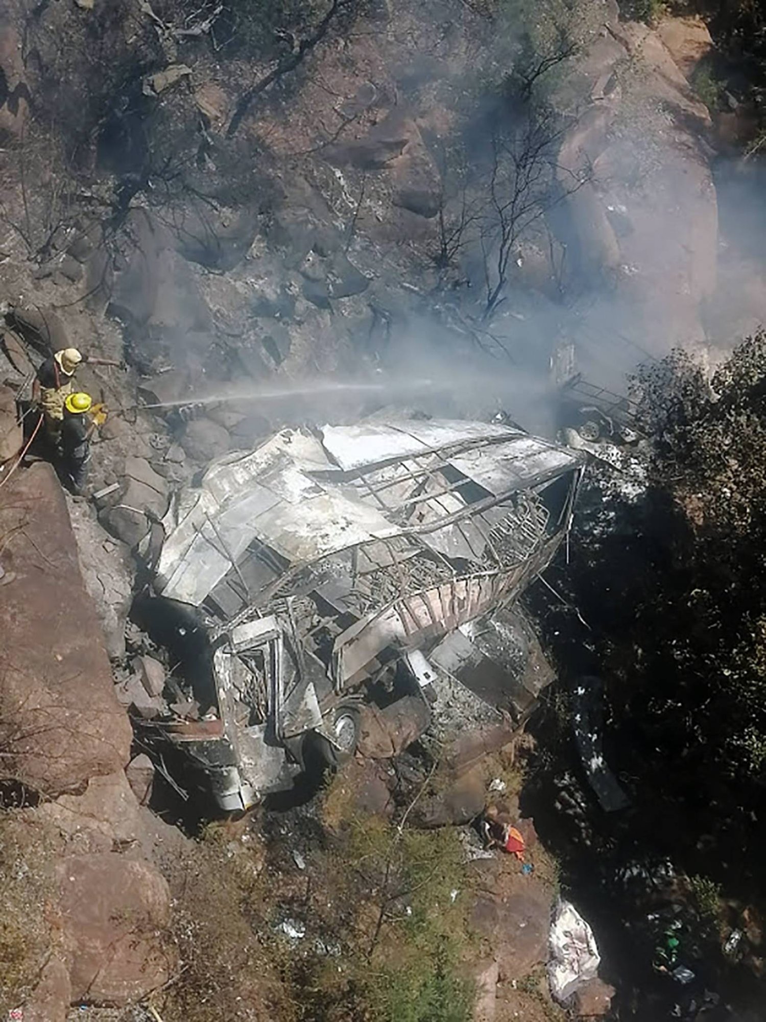 A handout photo made available by the Limpopo Transport Department shows emergency services attending to the bus crash that killed 45 people in Limpopo province, South Africa, 28 March 2024 (issued 29 March 2024).  EPA/Tidimalo Chuene
