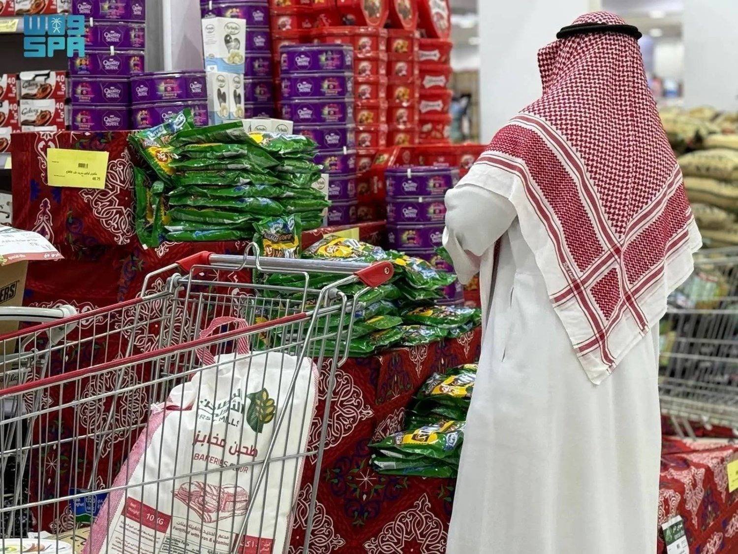 A Saudi citizen buys sweets from one of the major stores in preparation for Eid al-Fitr (SPA)