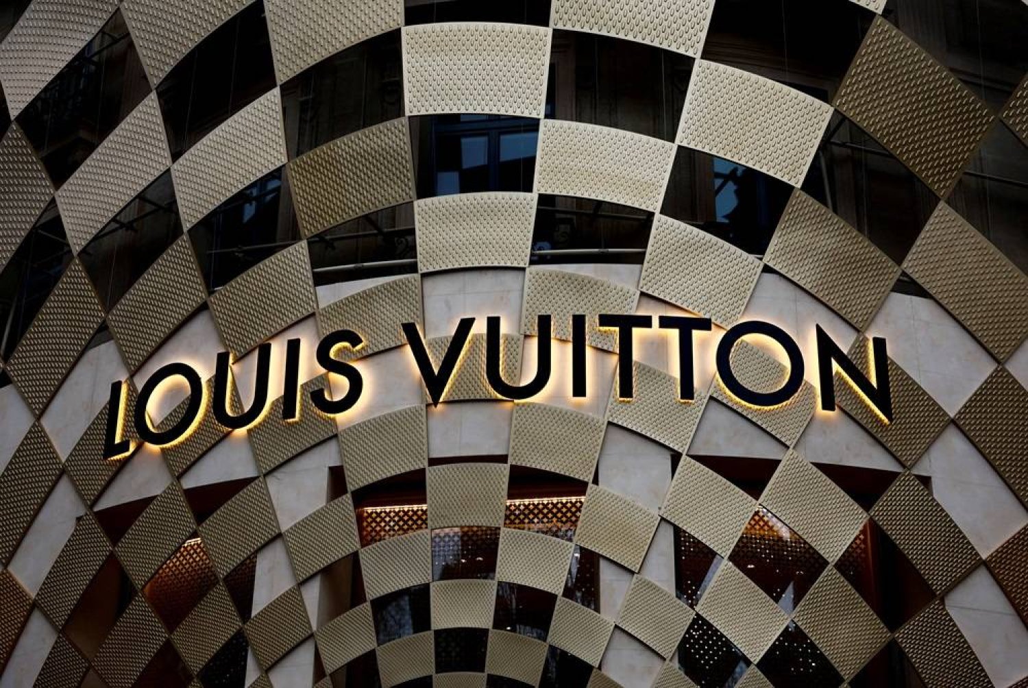 A logo of Louis Vuitton is displayed on a Louis Vuitton store on the Champs-Elysees avenue in Paris, France, March 30, 2024. (Reuters)