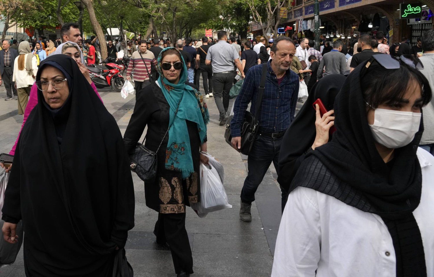 People walk around the old main bazaar in Tehran, Iran, Tuesday, April 16, 2024. (AP Photo/Vahid Salemi)