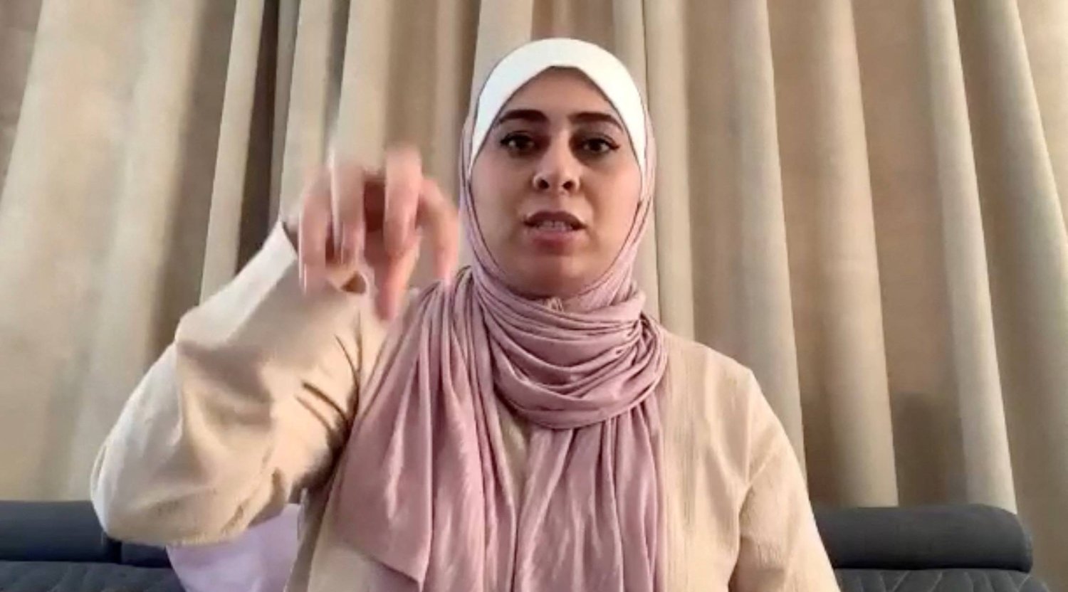 Palestinian woman Seba Jaafarawi, whose IVF embryos were stored at Al Basma IVF Center, gestures during an interview with Reuters via Zoom, in Cairo, Egypt, March 28, 2024, in this still image taken from a video. REUTERS/Reuters TV