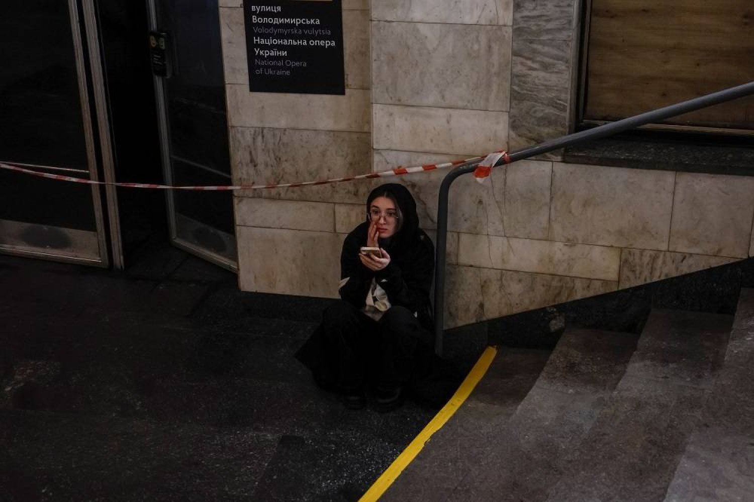 A woman takes shelter inside a metro station during a Russian missile strike, amid Russia's attacks on Ukraine, in Kyiv, Ukraine, April 17, 2024. (Reuters)