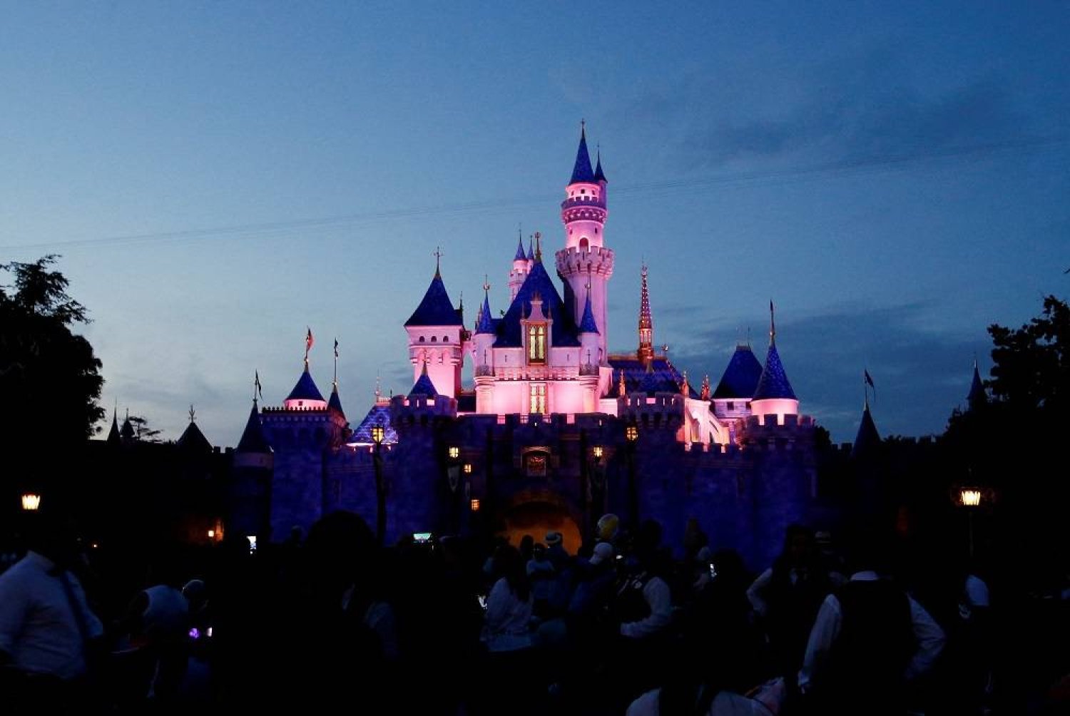 The Sleeping Beauty Castle is pictured at dusk at Disneyland Park in Anaheim, California, US, July 24, 2021. Picture taken July 24, 2021. (Reuters)