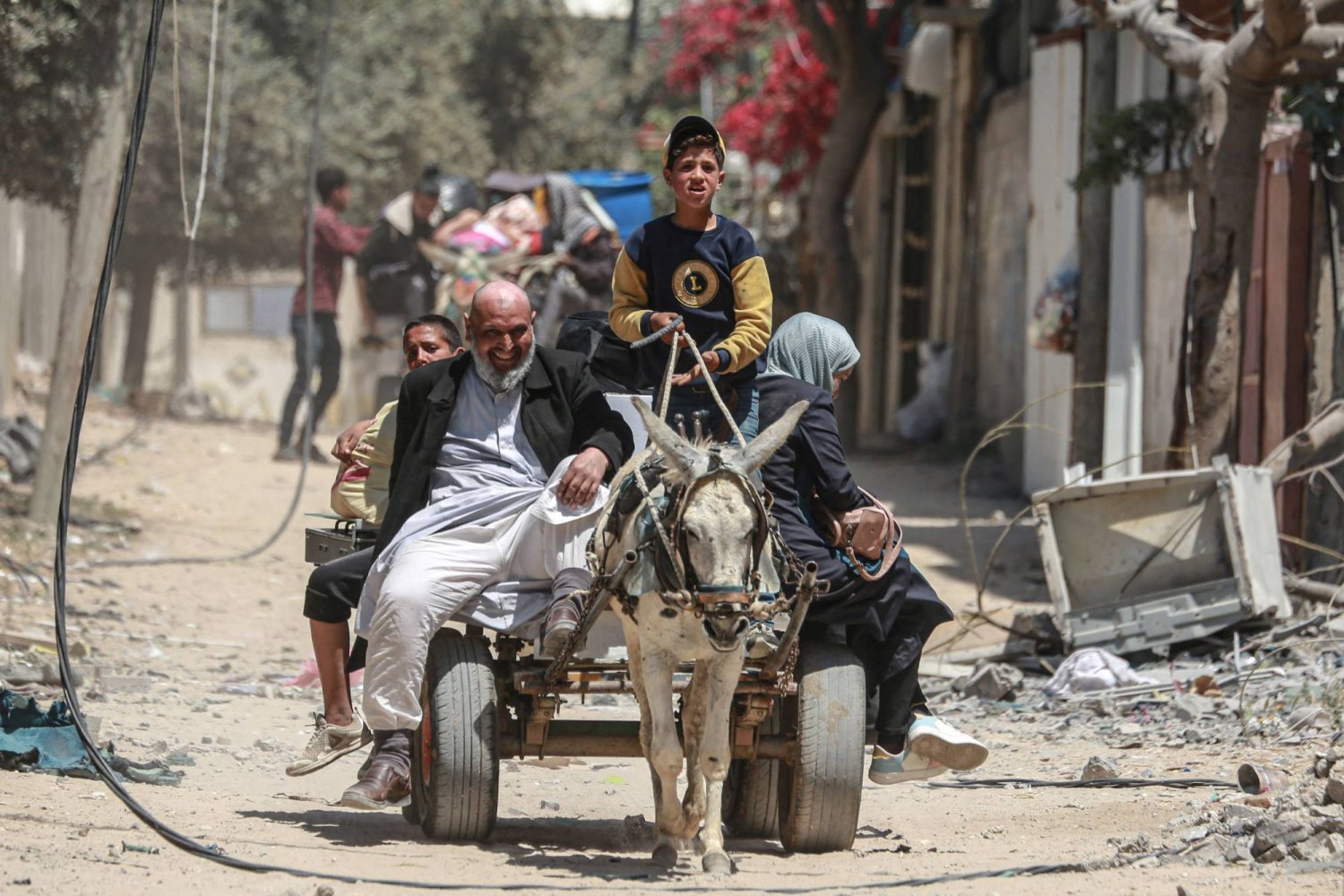 Palestinians flee their homes in the city of Nuseirat in the central Gaza Strip on April 17, 2024, amid ongoing battles between Israel and the Hamas group. (Photo by AFP)