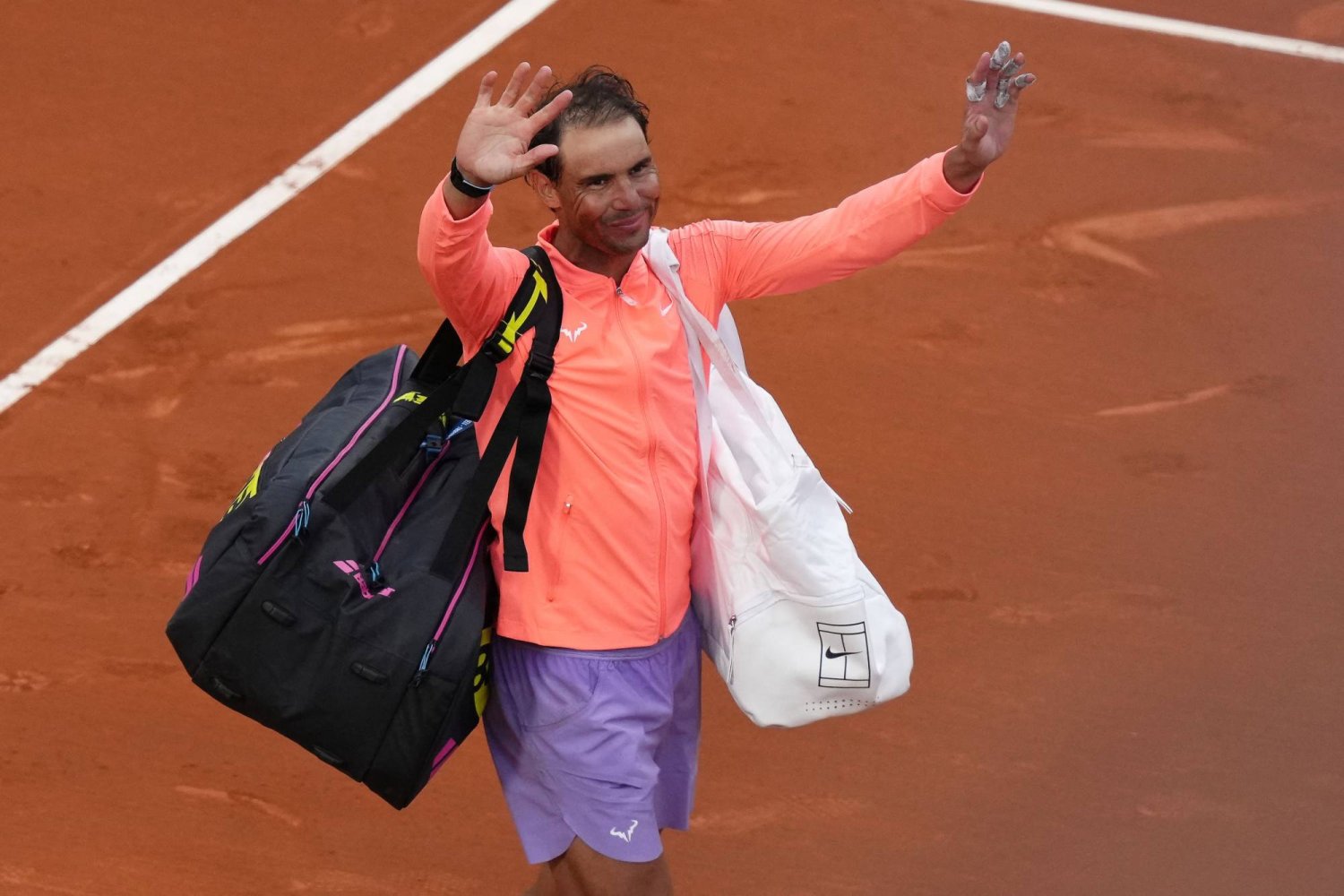Spain's Rafael Nadal gestures as he leaves the court after losing against Australia's Alex De Minaur during the ATP Barcelona Open "Conde de Godo" tennis tournament singles match at the Real Club de Tenis in Barcelona, on April 17, 2024. (Photo by PAU BARRENA / AFP)