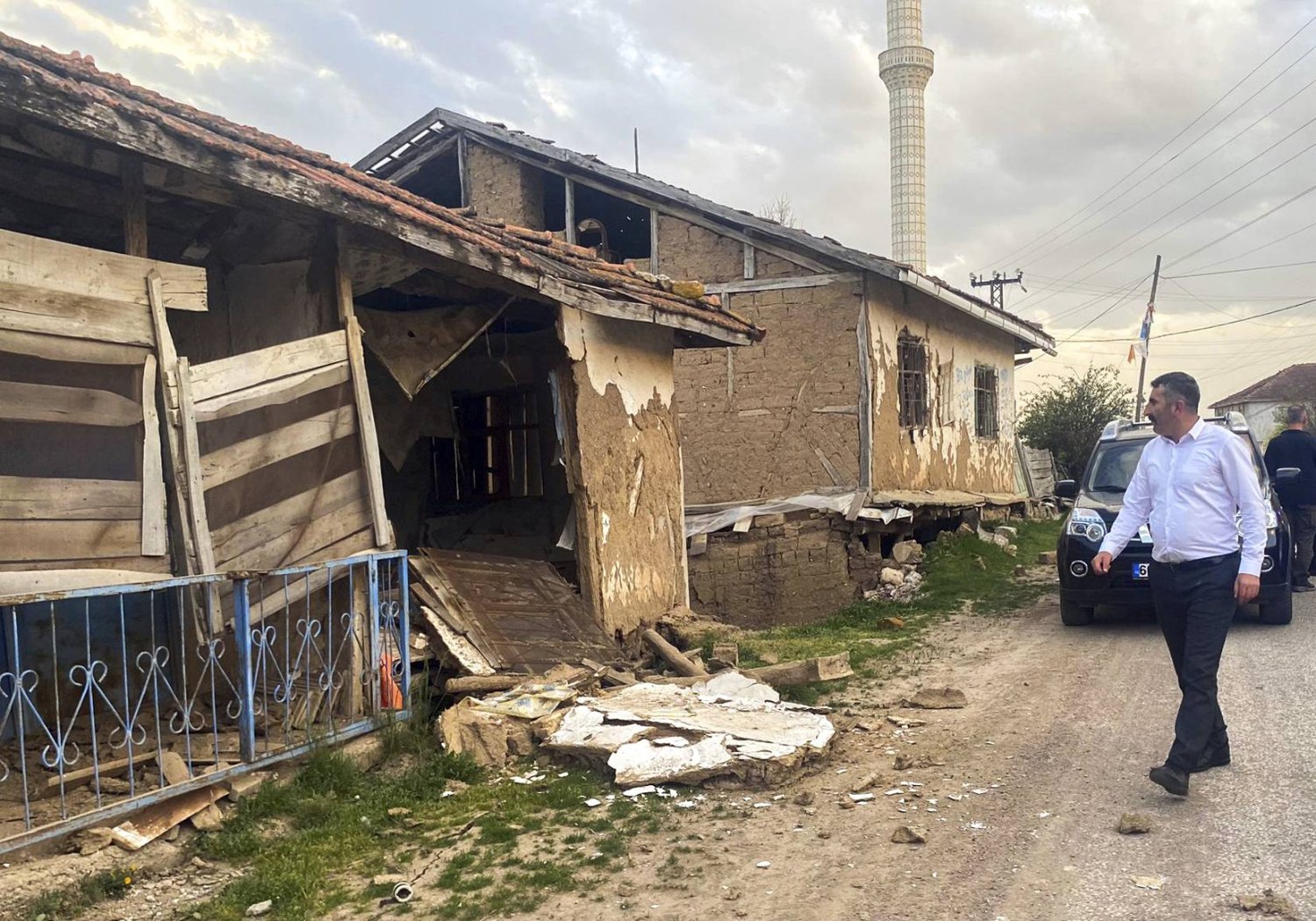 A man looks at the damage caused by a moderately-strong earthquake that struck Tokat province, some 450 kilometers east of the capital, Ankara, Türkiye, Thursday, April 18, 2024. (Dia Images via AP)