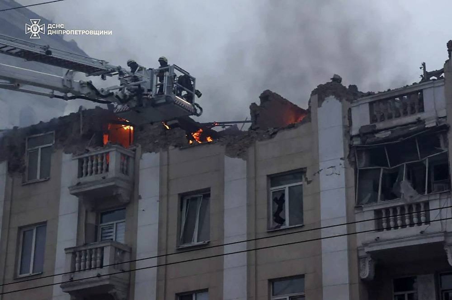 A handout photo made available by the State Emergency Service shows Ukrainian rescuers working at the site of a rocket attack on a residential building in the city of Dnipro, Dnipropetrovsk region, southeastern Ukraine, 19 April 2024, amid the Russian invasion. (EPA/State Emergency Service Handout Handout)