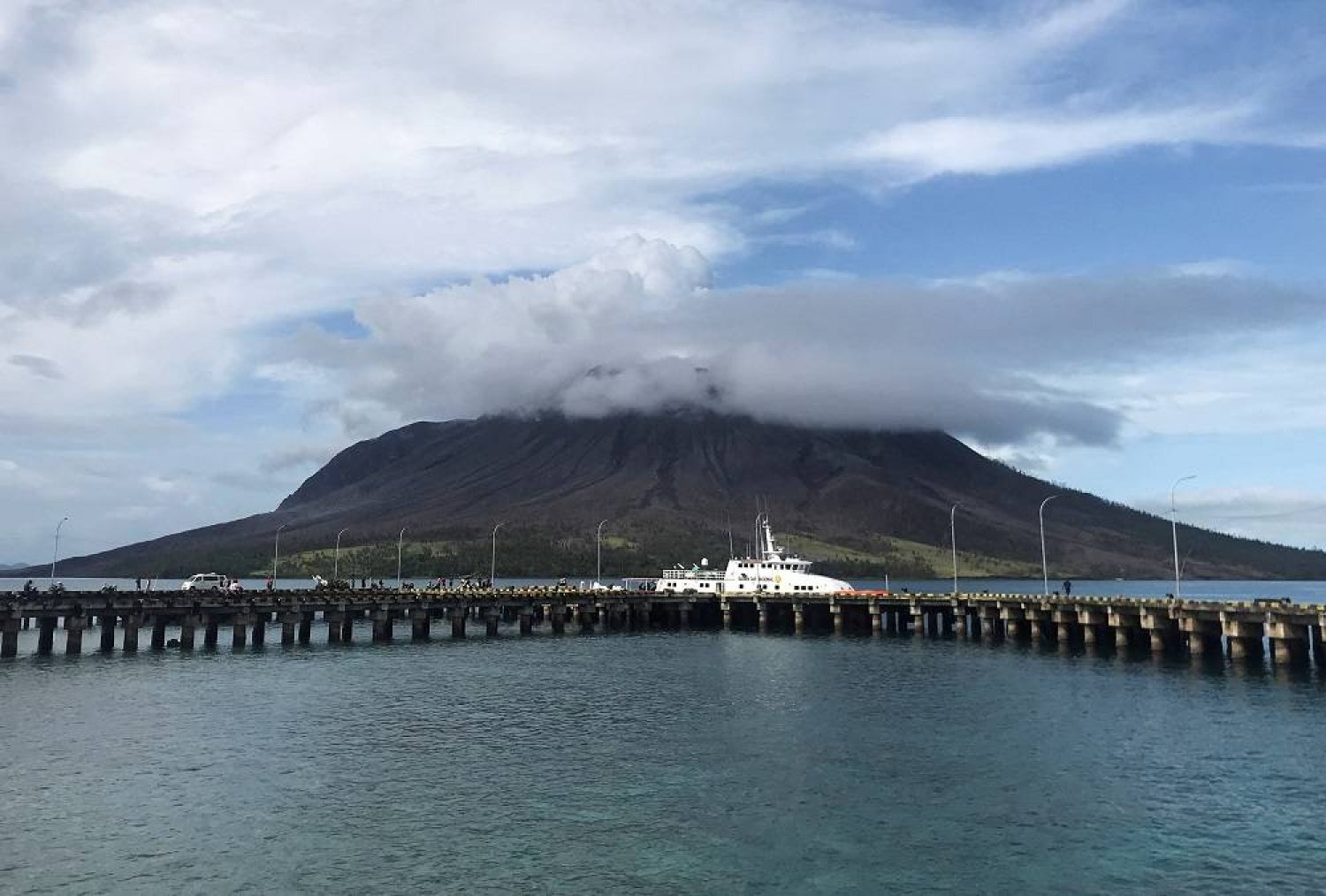Search and rescue boat is docked on the port of Tagulandang as Mount Ruang volcano spews volcanic ash in Sitaro Islands Regency, North Sulawesi province, Indonesia, April 19, 2024. (Reuters)