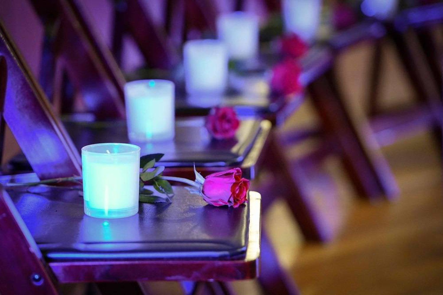 Roses and candles sit on chairs for each of the shooting victims during a 25th Year Remembrance ceremony on April 19, 2024 at First Baptist Church of Denver in Denver, Colorado. (Getty Images/AFP)