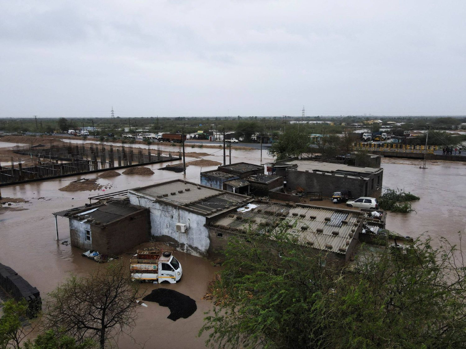 FILE PHOTO: A drone view of a flooded village in Mokhada after Cyclone Biparjoy made landfall, in the western state of Gujarat, India, June 16, 2023. REUTERS/Francis Mascarenhas/File Photo