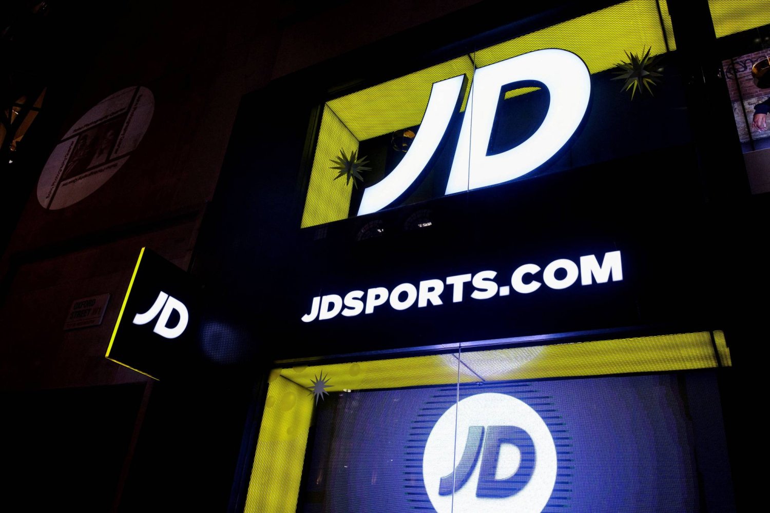 FILE PHOTO: JD Sports logo is seen on the exterior of a store in London, Britain, November 17, 2021. REUTERS/May James/File Photo