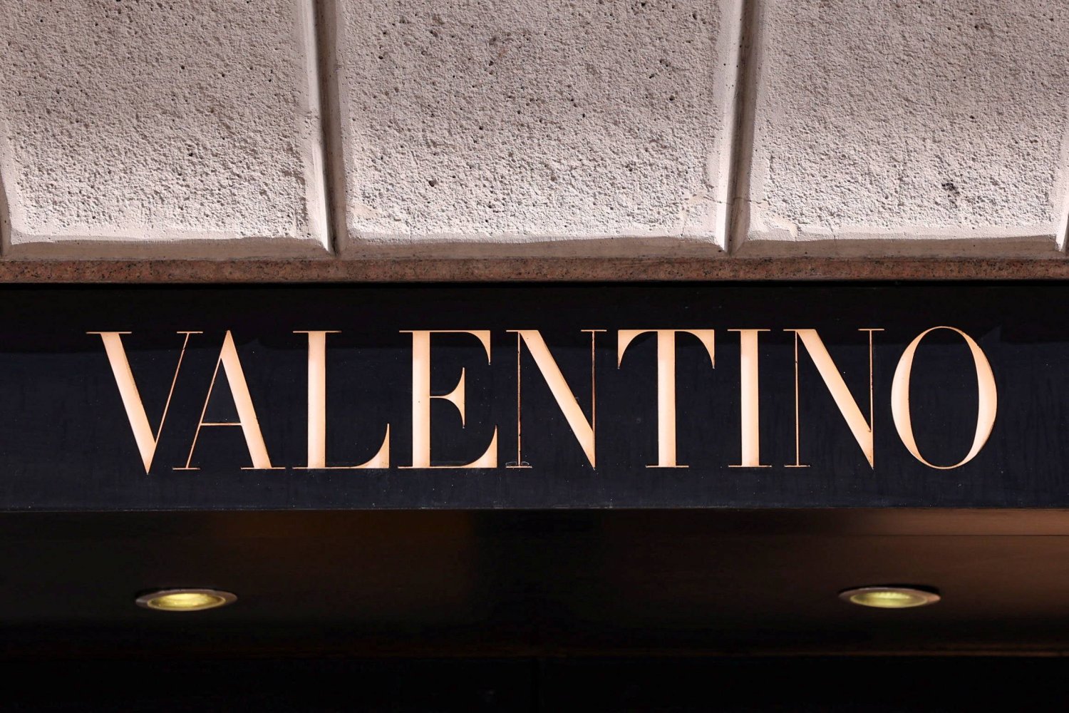 The logo of fashion house Valentino is seen outside a shop in Milan, Italy, April 8, 2024. REUTERS/Claudia Greco