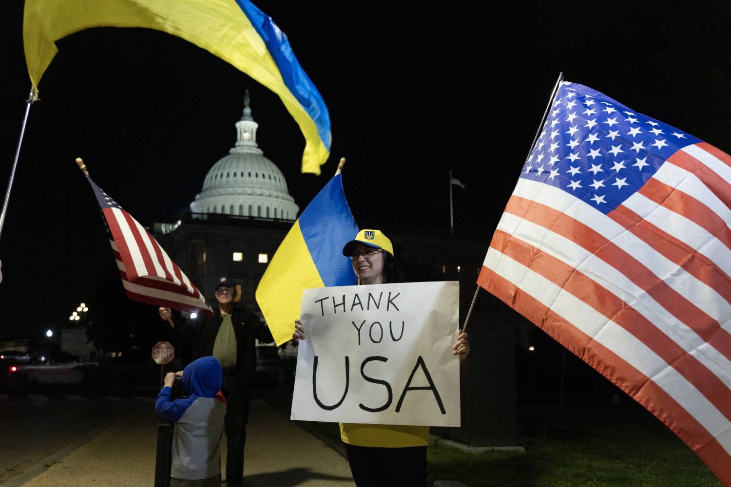 Supporters of Ukraine hold flags outside the US Capitol Building after the Senate passed the 95 billion USD national security supplemental that includes aid to Israel, Ukraine and Taiwan on Capitol Hill in Washington, DC, USA, 23 April 2024.  EPA/MICHAEL REYNOLDS