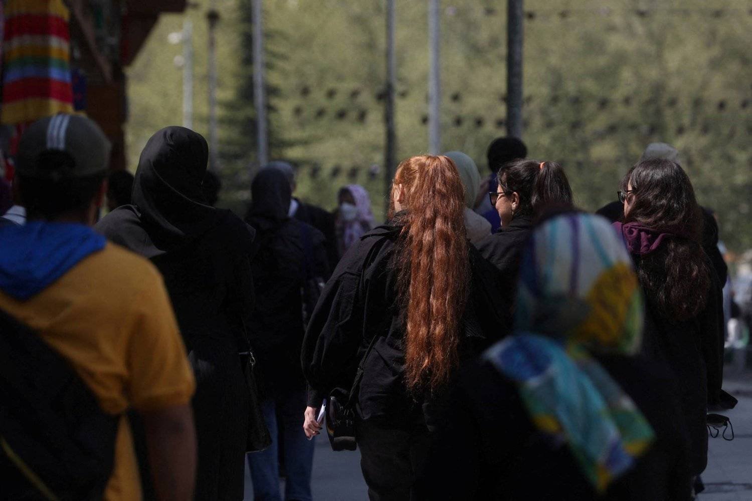 Iranian women walk on a street amid the implementation of the new hijab surveillance in Tehran, Iran, April 15, 2023. Majid Asgaripour/WANA (West Asia News Agency) via REUTERS/File photo