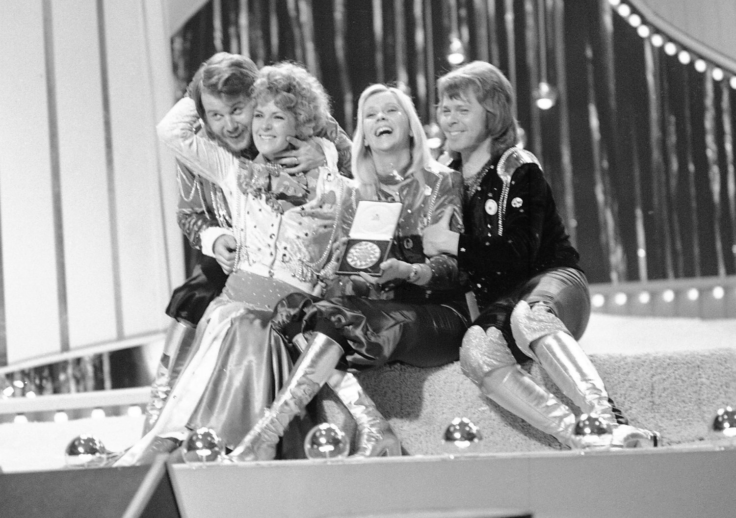 FILE - Swedish pop group ABBA celebrate winning the 1974 Eurovision Song Contest on stage at the Brighton Dome in England with their song Waterloo, April 6, 1974. (AP Photo/Robert Dear, File)