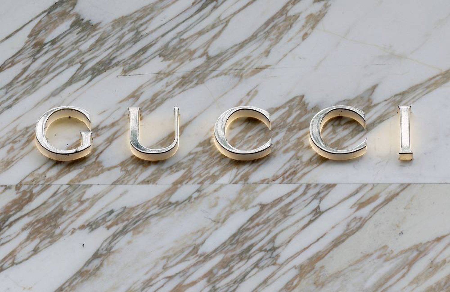 A logo of fashion house Gucci is seen outside a shop in Paris, France, April 15, 2024. (Reuters)