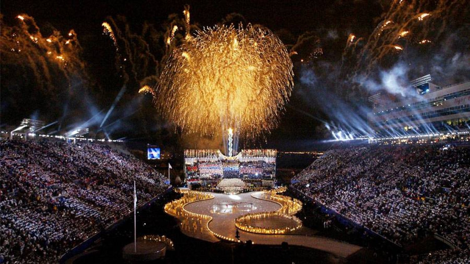Fireworks fill the night sky 08 February 2002 during the opening ceremonies of the XIXth Winter Olympics at the Rice Eccles Stadium in Salt Lake City, Utah. (AFP via Getty Images)
