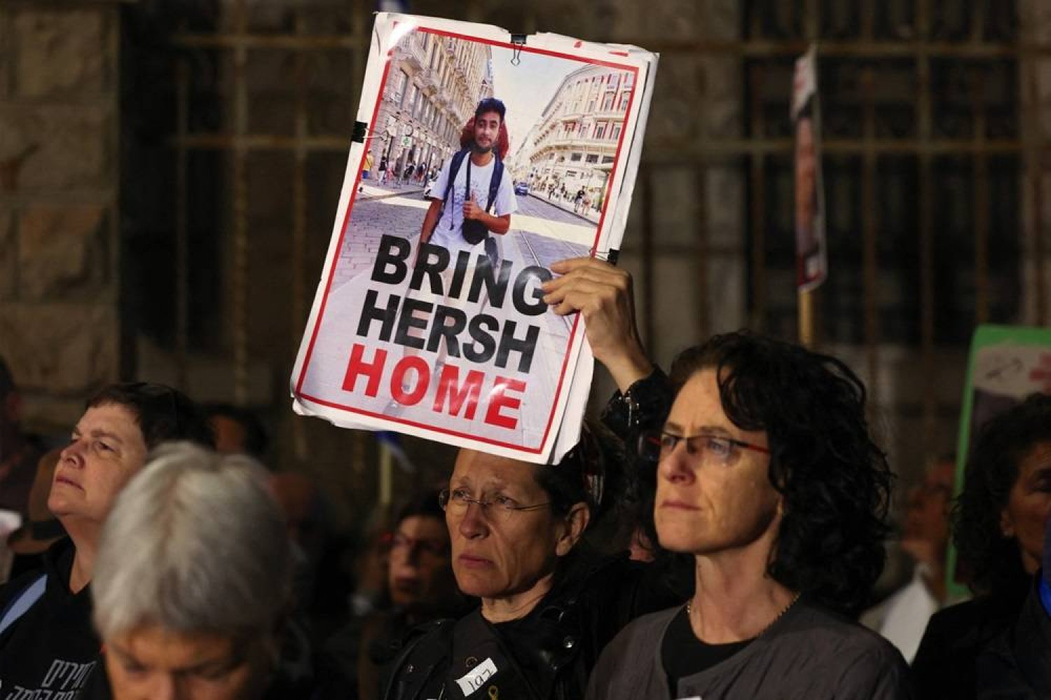  Relatives and supporters of Israeli hostages held in Gaza since the October 7 attacks by Hamas militants hold a portrait of US-Israeli Hersh Golgberg-Polin during a demonstration calling for the release of those taken near the residence of the Israeli prime minister in Jerusalem on April 20, 2024. (AFP) 