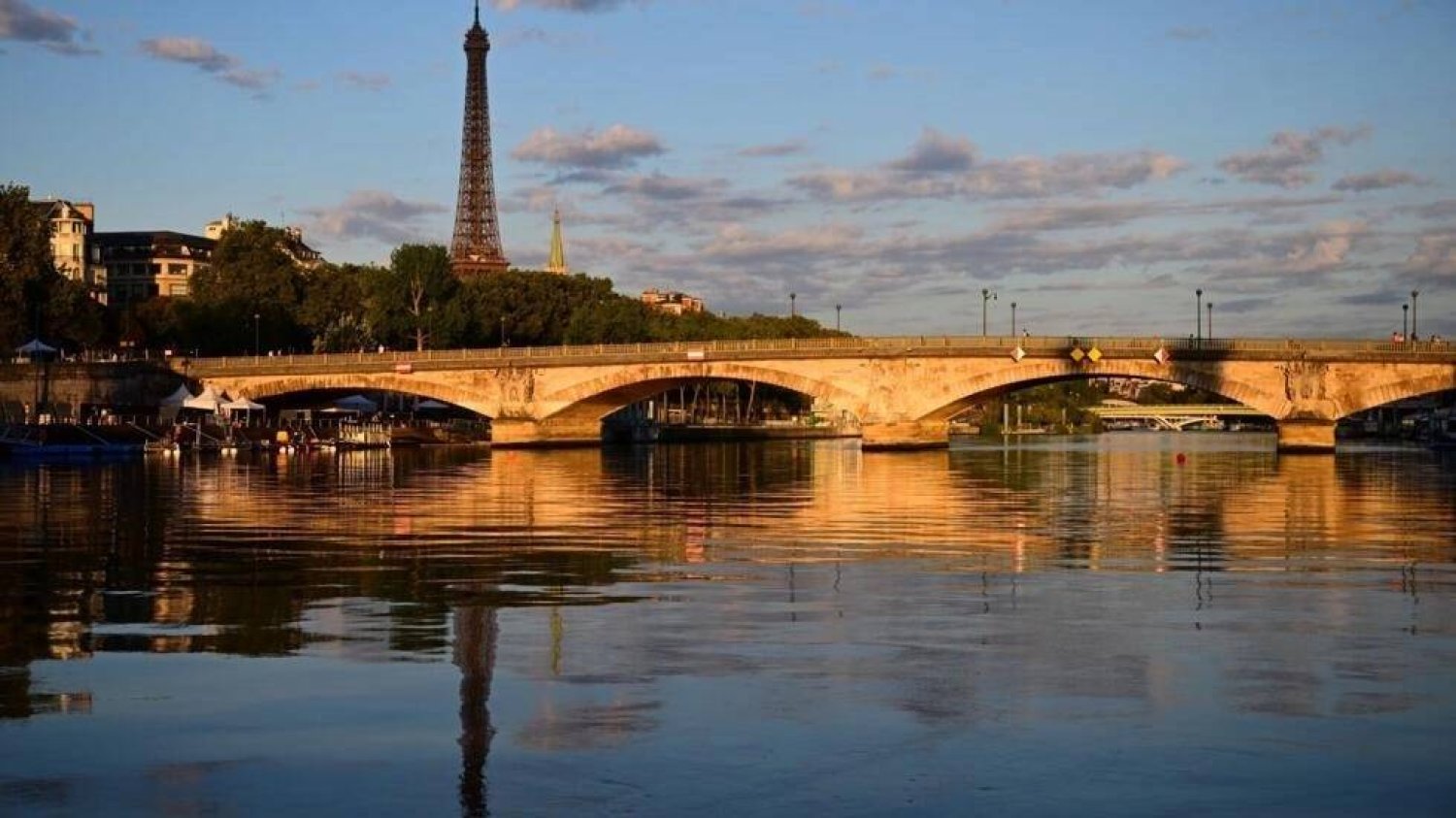 The river Seine will host the opening ceremony of the summer Paris Olympics. Emmanuel DUNAND / AFP/File