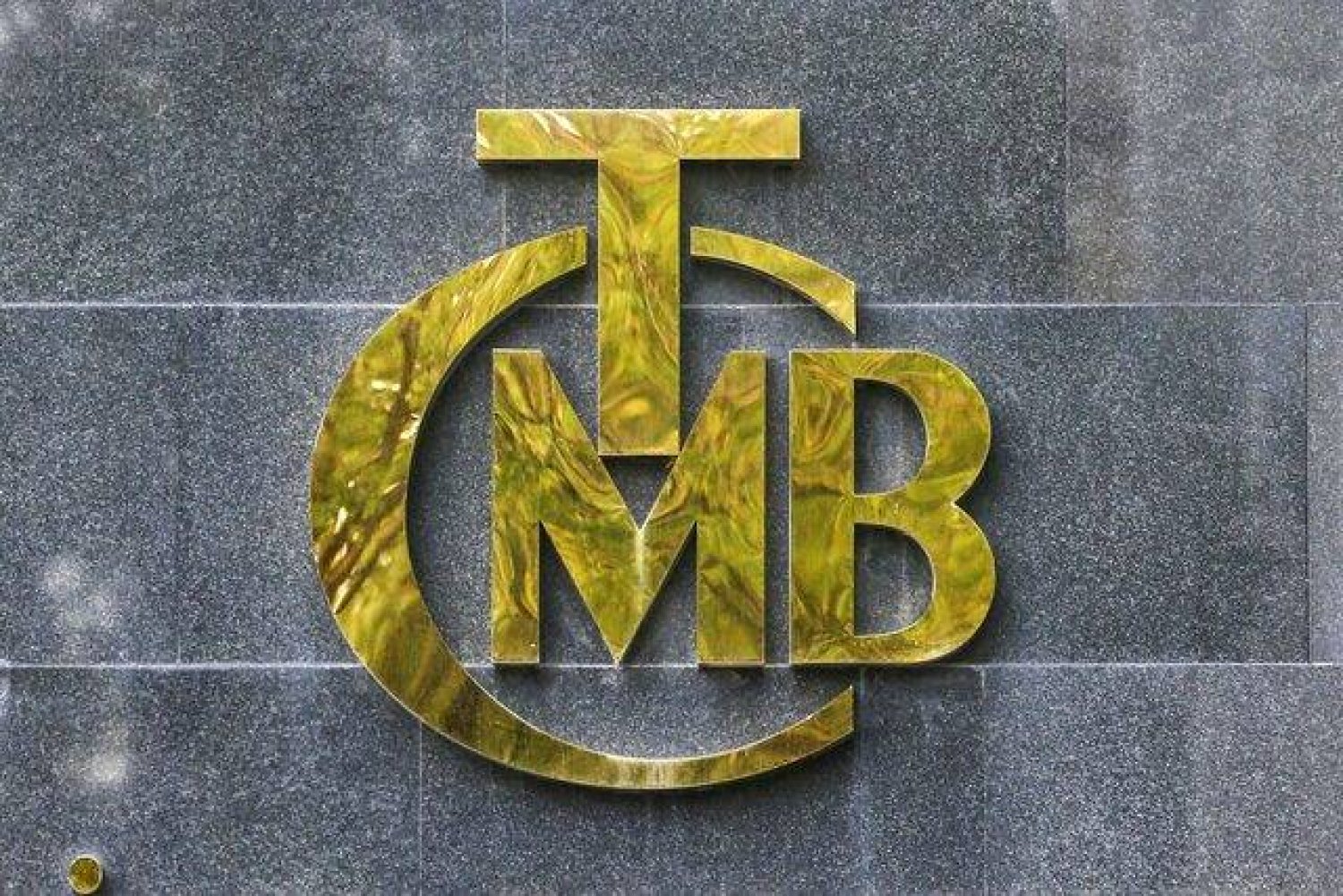 A logo of Türkiye's Central Bank is pictured at the entrance of its headquarters in Ankara, Turkey October 15, 2021. REUTERS/Cagla Gurdogan/File Photo