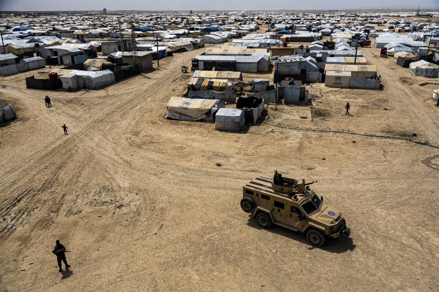 FILE - Kurdish forces patrol al-Hol camp, which houses families of members of the ISIS group in Hasakeh province, Syria, on April 19, 2023. (AP Photo/Baderkhan Ahmad, File)