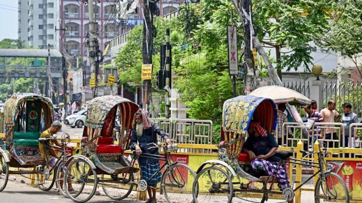 Rickshaw pullers rest from the heat in Dhaka -- the United Nations said this week Asia was the region most affected by climate and weather hazards in 2023. MUNIR UZ ZAMAN / AFP