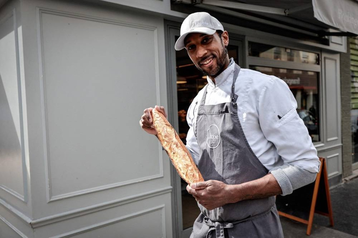Baker Xavier Netry poses at his bakery named "Utopie" in Paris on April 26, 2024, after being awarded best baguette 2024 of the city of Paris (Grand Prix de la Baguette de Tradition Francaise de la Ville De Paris). (AFP) 