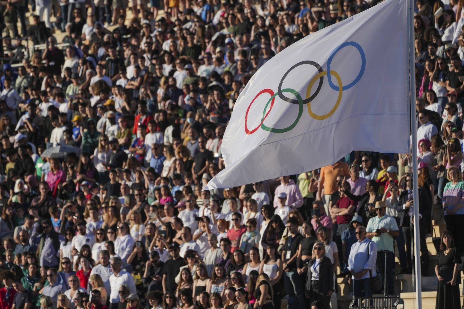The Olympic flag flies during the Olympic flame handover ceremony, Friday, April 26, 2024, in Athens, at Panathenaic stadium, where the first modern games were held in 1896. (AP Photo/Petros Giannakouris)