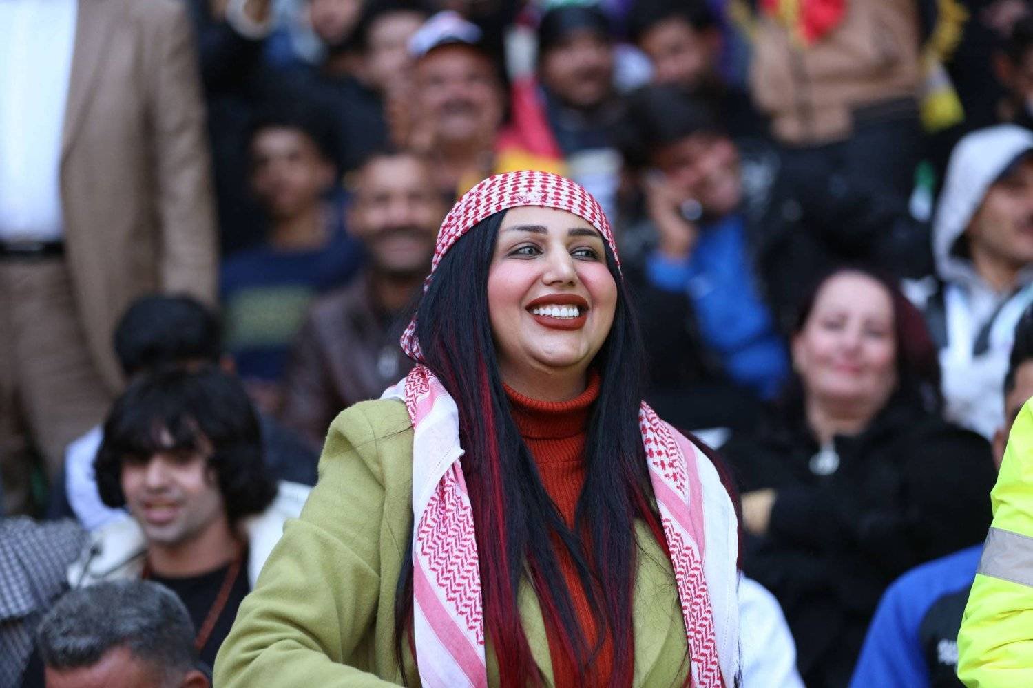 Iraqi TikTok celebrity Um Fahad is pictured at the Basra International Stadium during a match of the Arabian Gulf Cup football tournament on January 19, 2023. (Photo by Hussein FALEH / AFP)